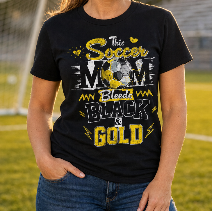 This Soccer Mom Bleeds Black & Gold — Tee
